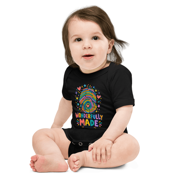 Wonderfully Made Fingerprint Psalm 139:14 Baby Onesie on a smiling baby, showcasing faith and love in colorful design.