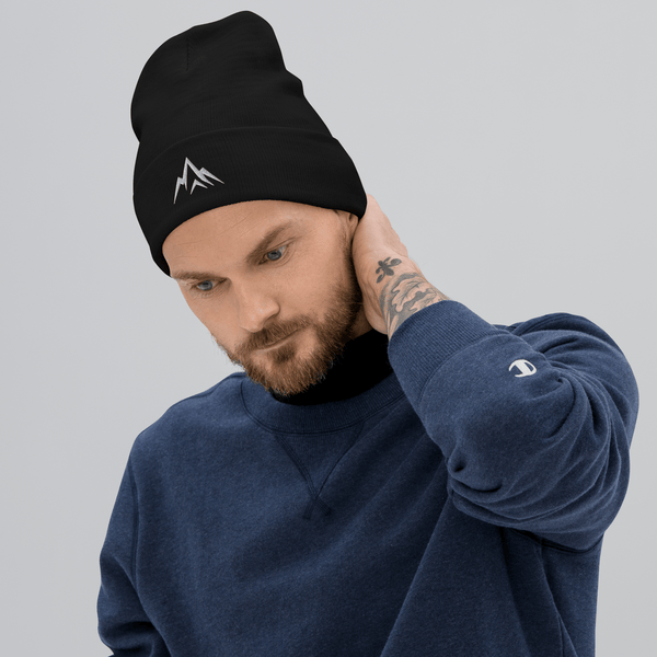 Man wearing Unshaken Apparel Embroidered Beanie, showcasing strength and faith in an athletic style.