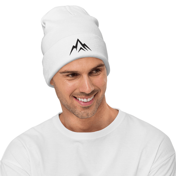 Man wearing a white Unshaken Apparel Embroidered Beanie with mountain logo, showcasing strength and faith.