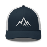 Unshaken Apparel Logo Trucker Hat in navy and white with mountain logo, representing faith, strength, and discipline.