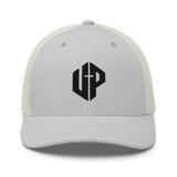 Unshaken Performance Cross Logo Trucker Cap in silver, showcasing bold UP emblem representing faith and modern Christian apparel.