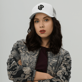 Unshaken Performance Cross Logo Trucker Cap worn by a model, showcasing faith and style in Christian apparel.