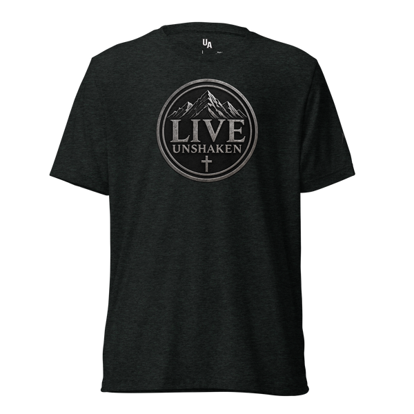 Live Unshaken Mountain Emblem T-Shirt featuring rugged design, cross, and mountain peaks symbolizing faith.