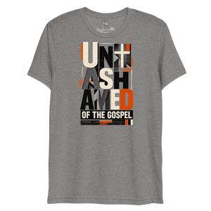 Unashamed of the Gospel Romans 1:16 Christian T-Shirt in grey triblend, bold typography with cross and orange accents.