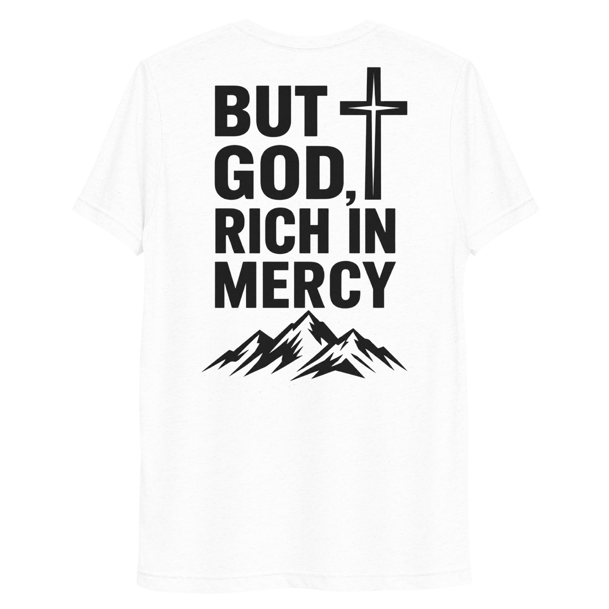 But God, Rich in Mercy Christian Men's T-Shirt with mountain graphic, bold faith statement on solid white triblend fabric.