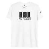 Be Bold. Live Unshaken T-Shirt in solid white triblend featuring a bold cross design and powerful Christian message of faith.