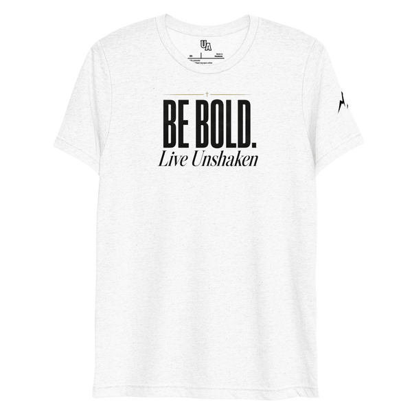 Be Bold. Live Unshaken T-Shirt in solid white triblend featuring a bold cross design and powerful Christian message of faith.
