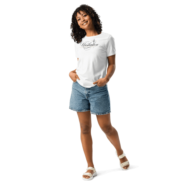 A woman wearing the Live Unshaken Cross - Women’s Relaxed T-Shirt paired with denim shorts, promoting faith and Christian apparel.