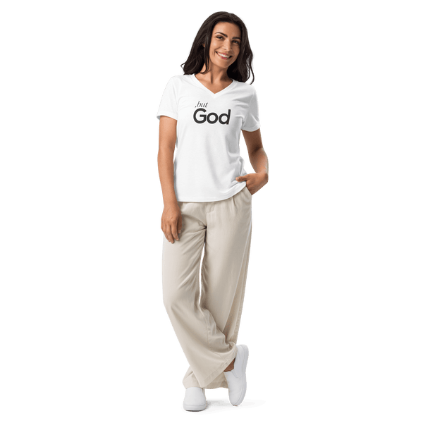 But, GOD. Bold Faith Women’s Relaxed V-Neck T-Shirt worn by a woman, showcasing its powerful Christian message.